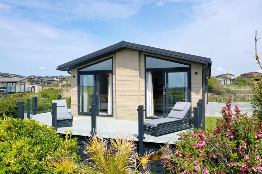 A Silver Bay lodge with its decking and garden